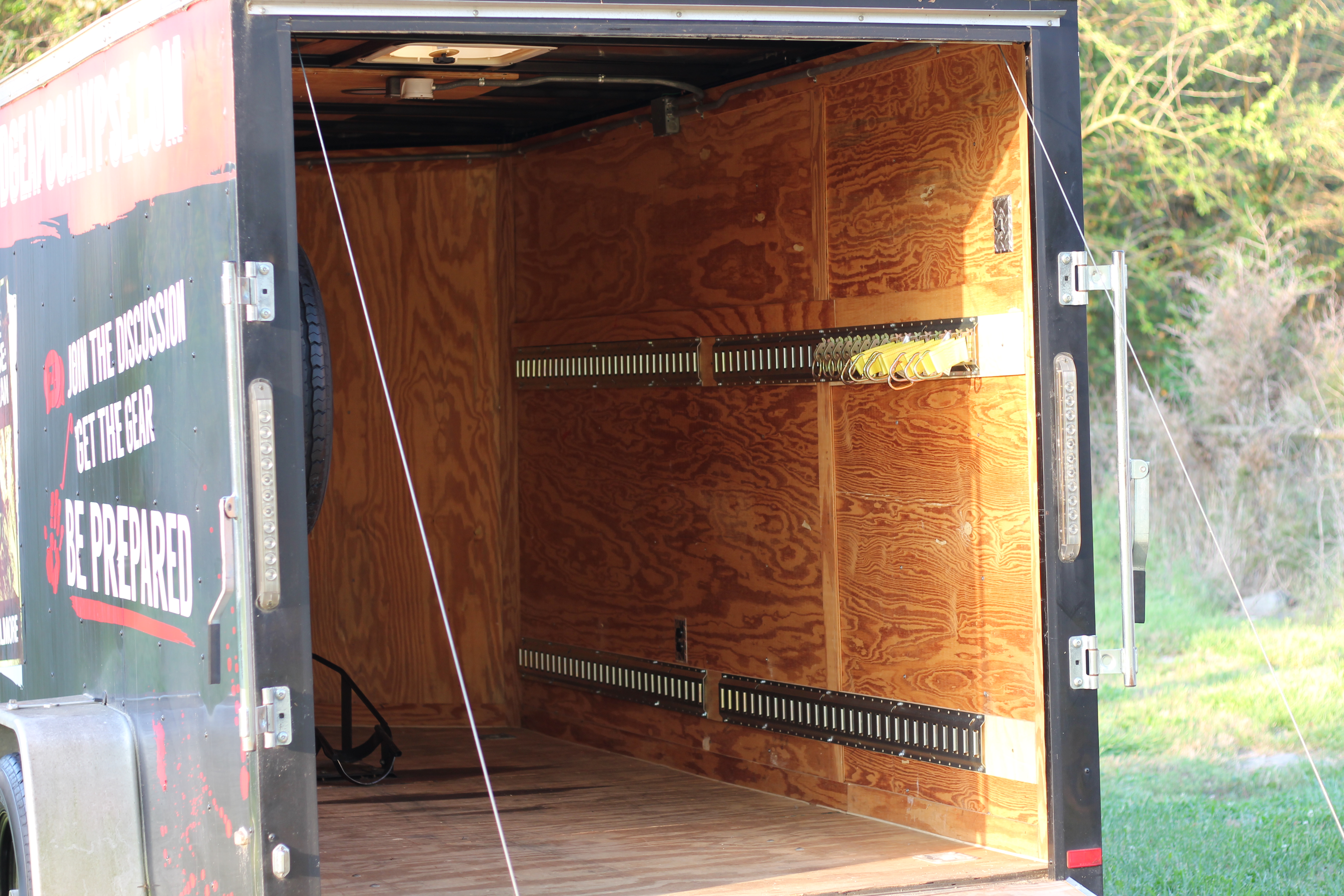 6x12 SA001 — interior cargo area with rear doors open